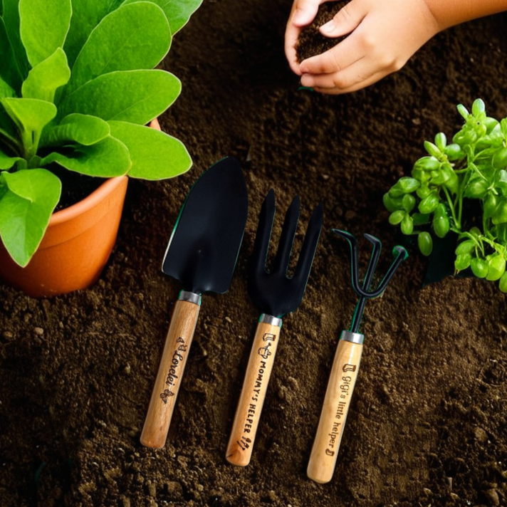 Engraved kids garden tools set in soil planter